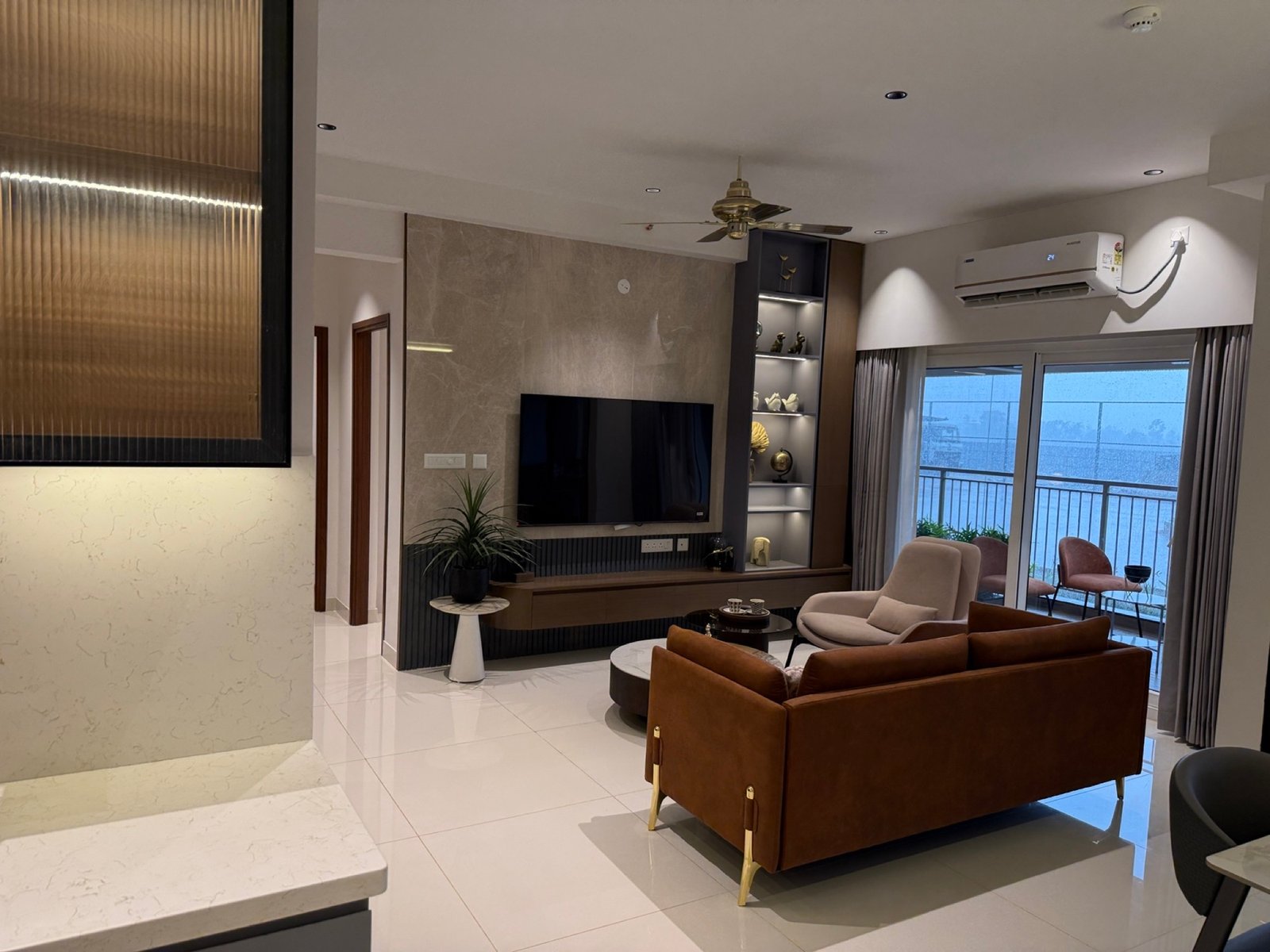 Living room with fitted furniture and lighting